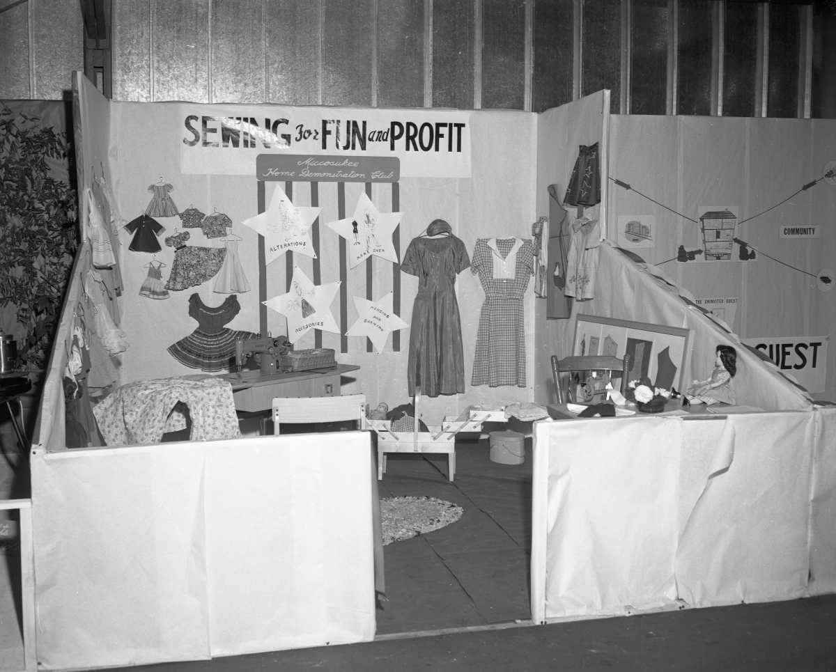 Home demonstration club booth on sewing