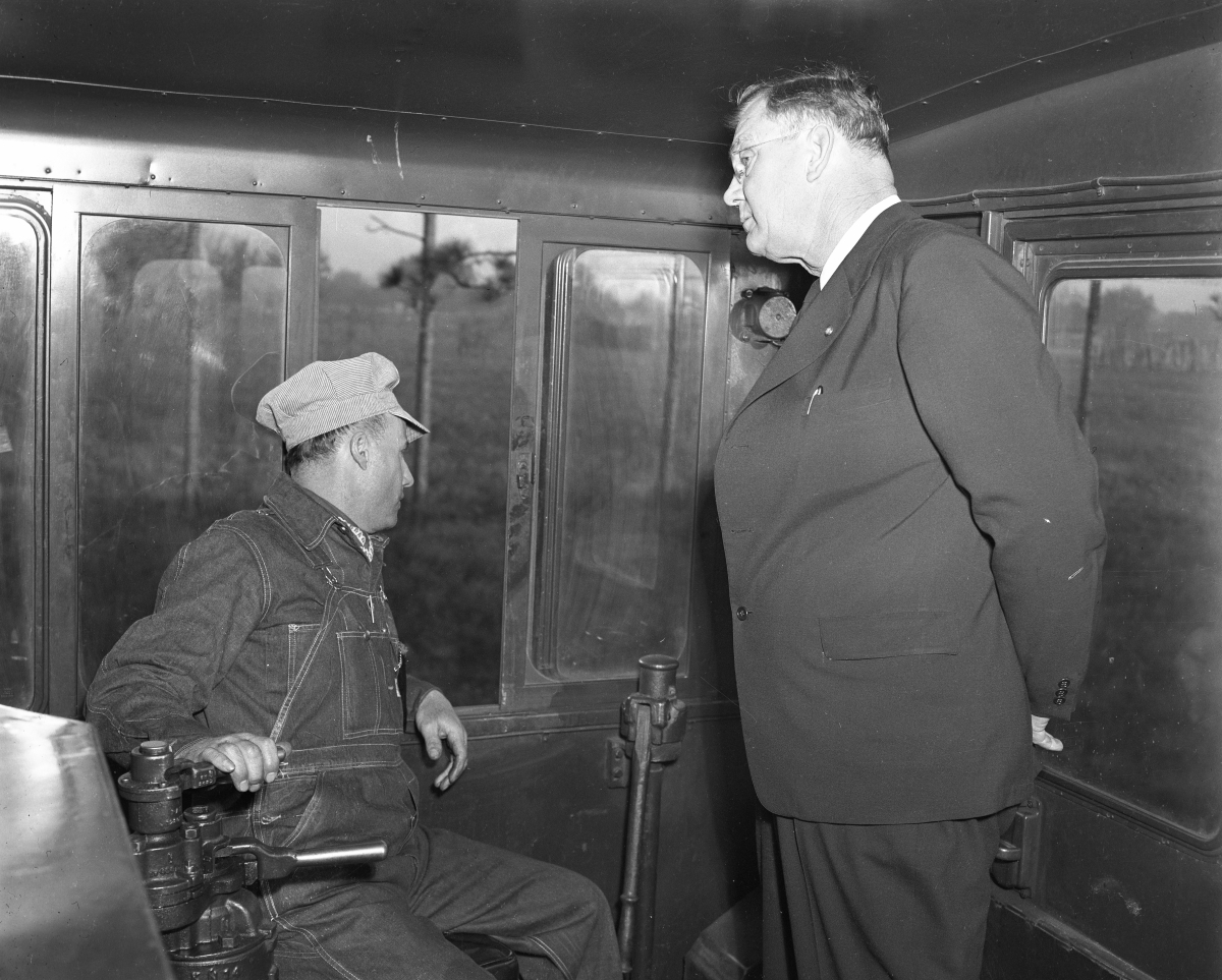 Inside the engine cab with an official and engineer