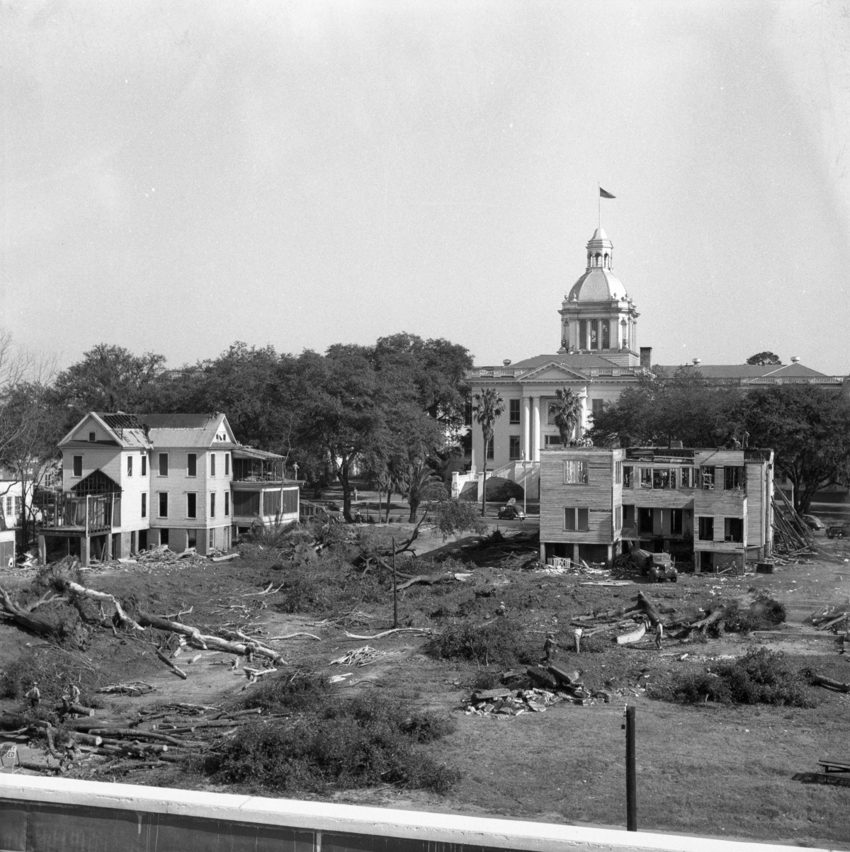 Two views of the demolition of homes surrounding the Capitol
