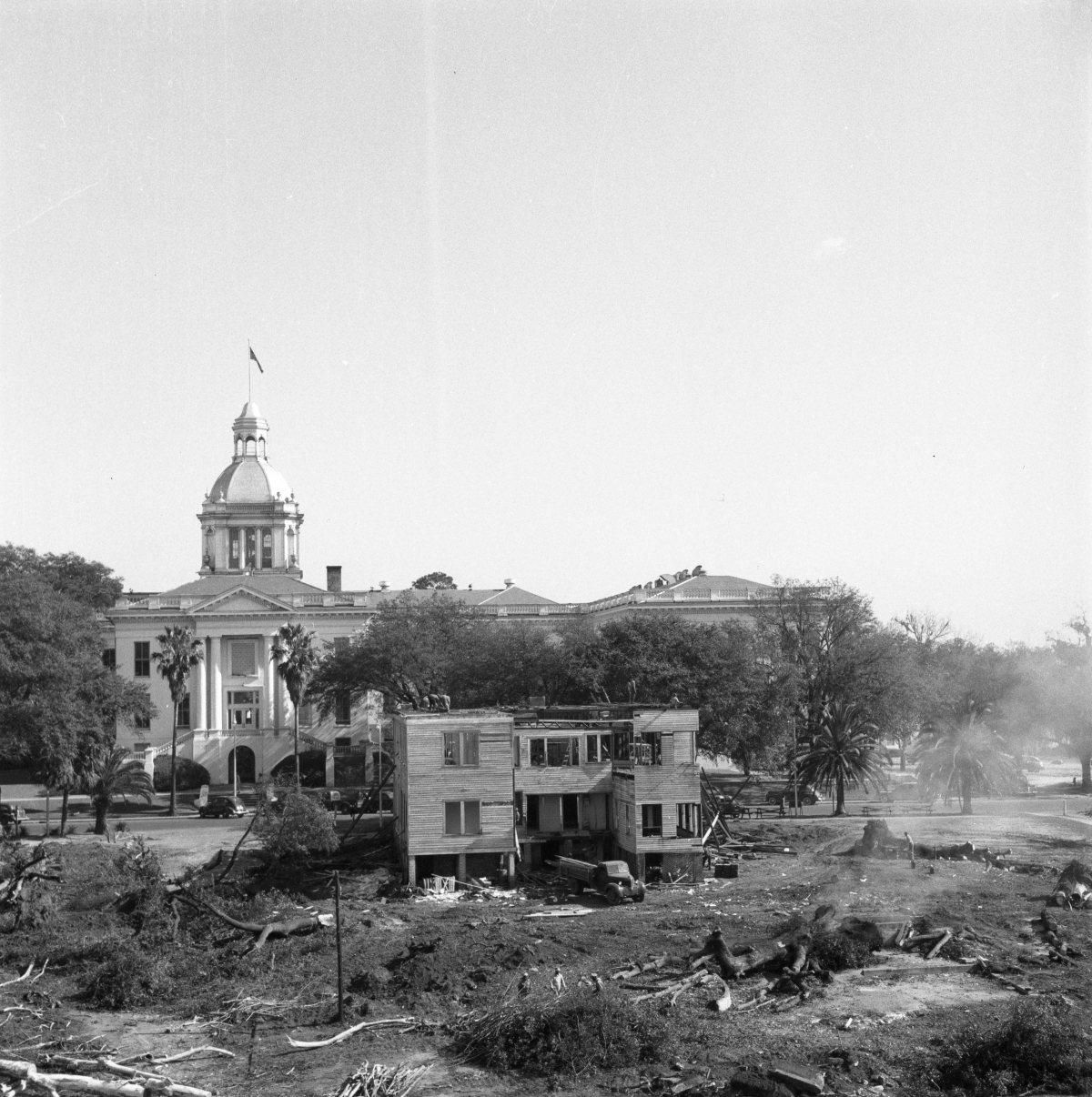 Two views of the demolition of homes surrounding the Capitol