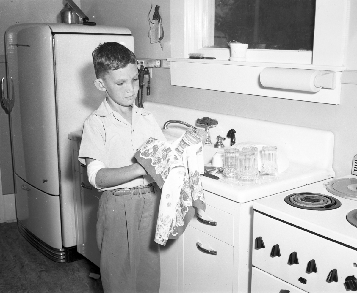 Ryan Edwards drying dishes.