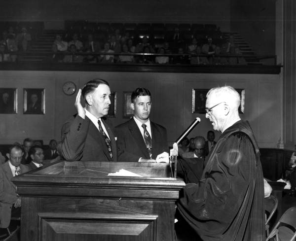 Charley E. Johns taking the oath of acting governor.