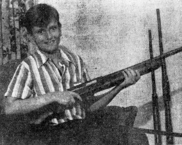 Billy Ben Holland holding a shotgun