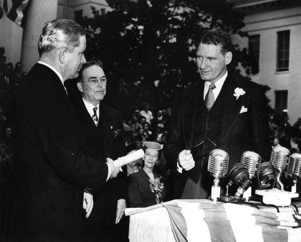 Secretary of State R.A. Gray witnessing the transfer of the Great Seal of State.