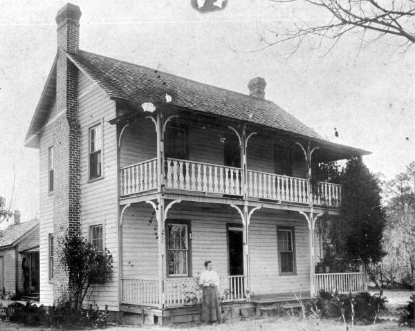 Mrs. W. E. Laughinghouse standing in front of her home - Hawthorne, Florida