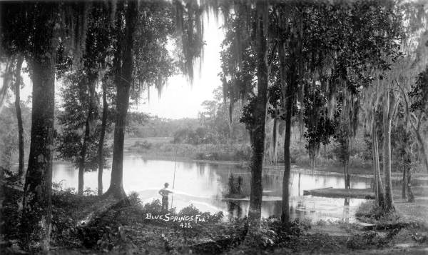 Man holding fishing pole at Blue Springs - Marion County, Florida