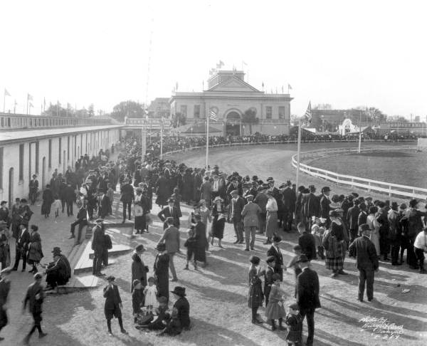 Crowds inside the Plant Field fairgrounds in vicinity of Wall Hall and grandstand - Tampa, Florida.