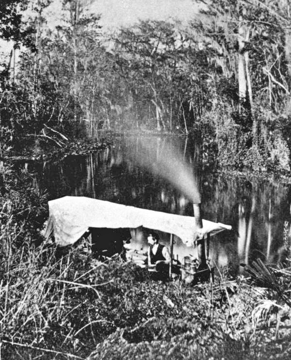 A man in a Sunday night camp on the boat at the Ocklawaha River - Putnam County, Florida