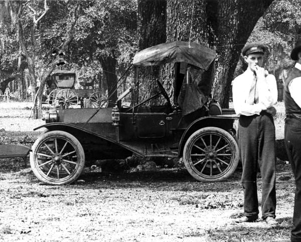 An automobile parked by a tree - Pensacola, Florida.