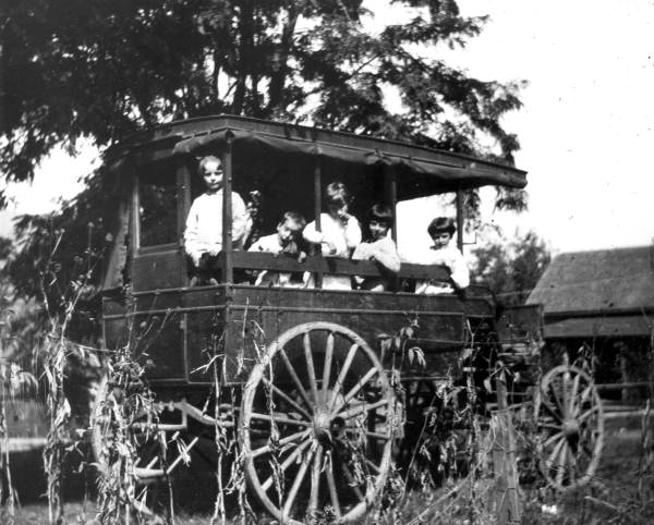 Children on a station wagon or a school bus(?) - Pensacola, Florida.