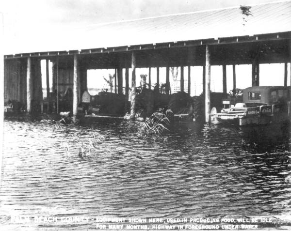 Farm equipment in flood waters - Palm Beach County, Florida.