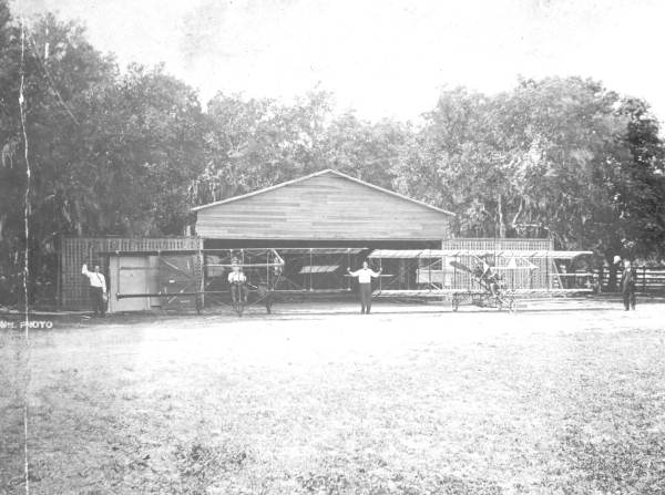 Early biplanes outside hangar - Kissimmee, Florida