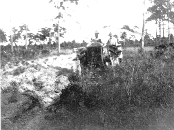 "Perry and Jim making a hard road" - Alva, Florida