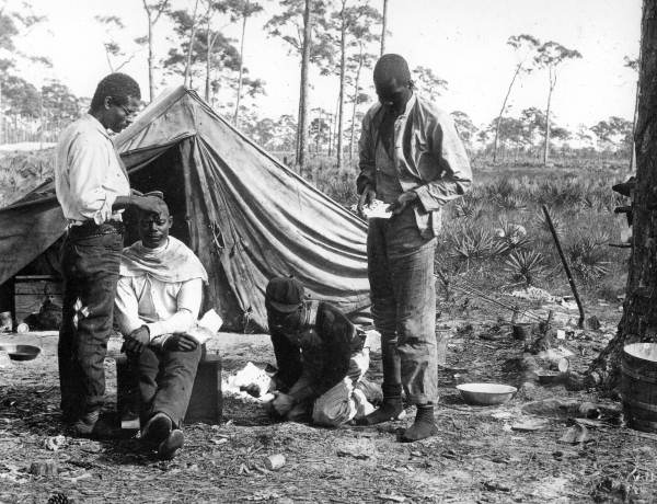 African Americans having their hair cut.
