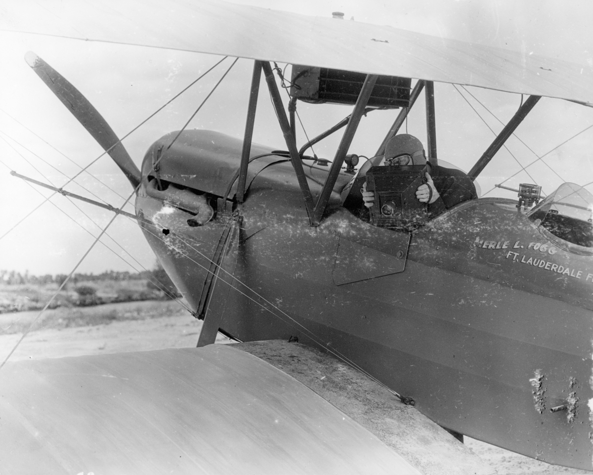 R.B. Hoit in biplane with camera- Miami, Florida
