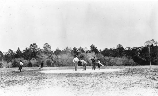 Golfers on the clay green at the New Ocklawaha Hotel golf course - Eustis, Florida