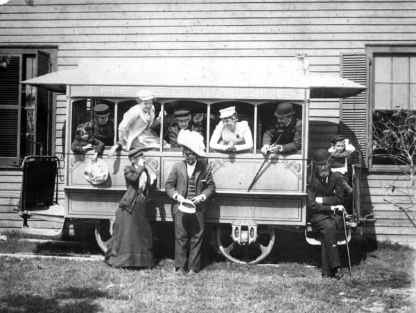 Group posed in and around an open trolley car "The Seminole" - Tampa, Florida.