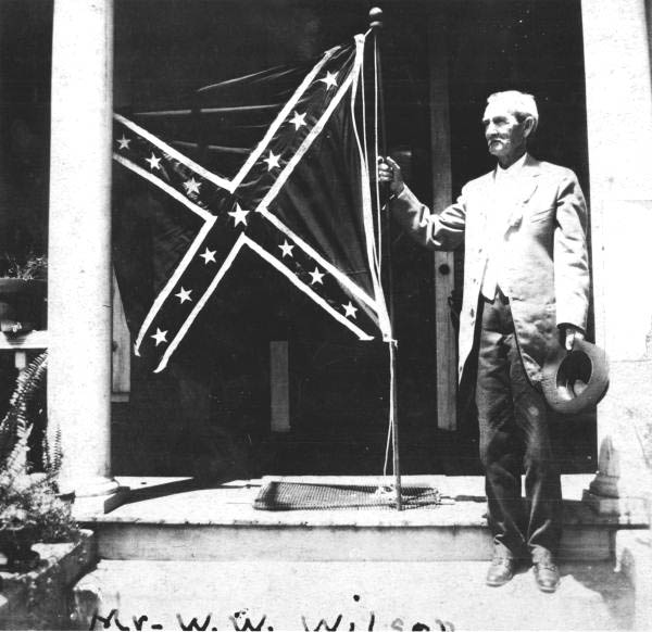 William W. Wilson holding confederate flag - Quincy, Florida