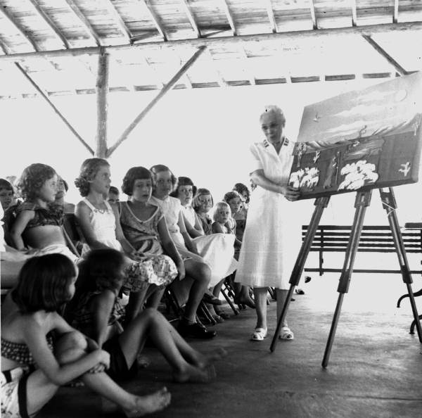 Salvation Army worker telling a Bible story at summer camp - Jacksonville, Florida.