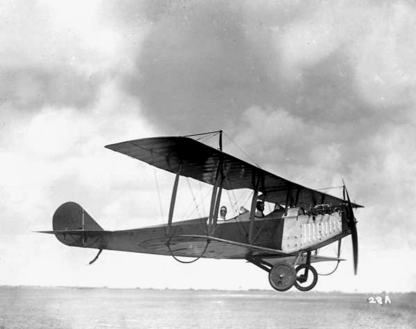 Biplane flying low to the ground: Miami, Florida
