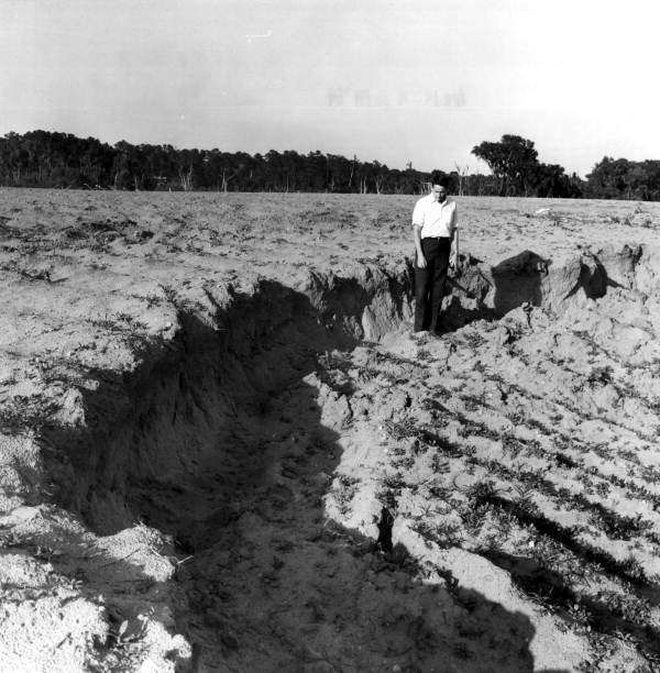Man standing in a sinkhole.