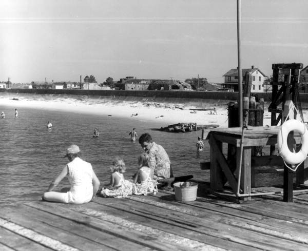 Fishing from Quartermaster's wharf with view of Fort Pickens in the background.