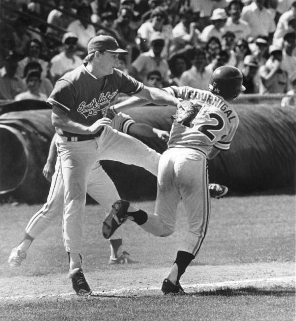 Florida State University base runner being tagged out by the opposition's pitcher - Tallahassee, Florida.