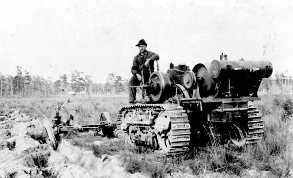 Ralph Driggers on tractor at Mr. Burt's Spring Garden Ranch