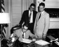 Governor Dan McCarty signing papers at his office - Tallahassee, Florida.