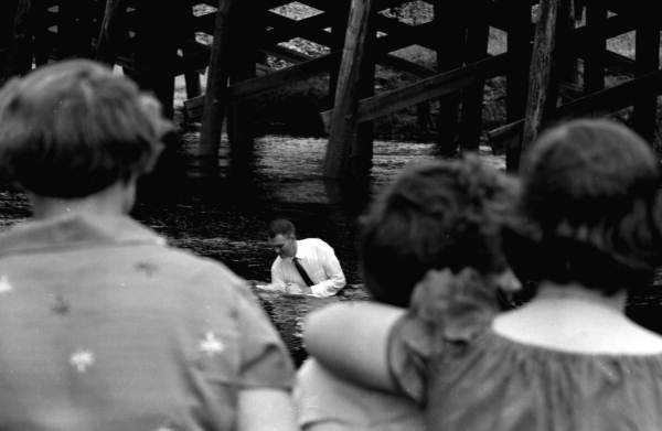 View showing a preacher performing a baptism in Leon County, Florida.