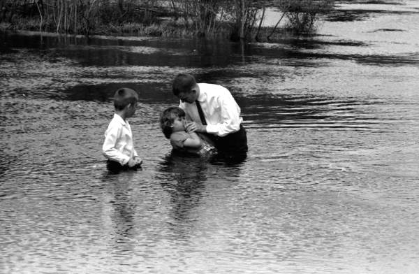 Preacher performing baptism in Leon County, Florida.