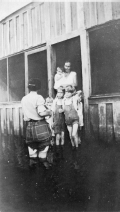 Public health nurse Jule Graves visiting with family during flood in LaBelle, Florida.