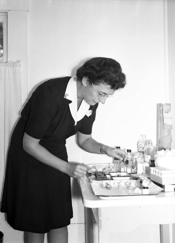 Public health nurse preparing medication in Miami, Florida.