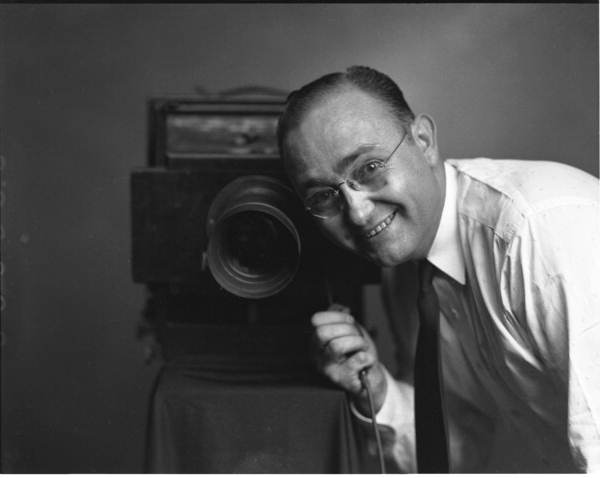 Portrait of Harvey Slade with his camera - Tallahassee, Florida.