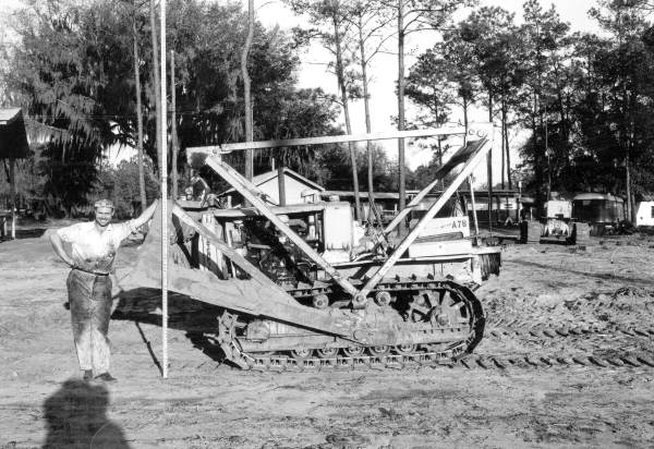 Unidentified worker with a Caterpiller Tractor Scraper
