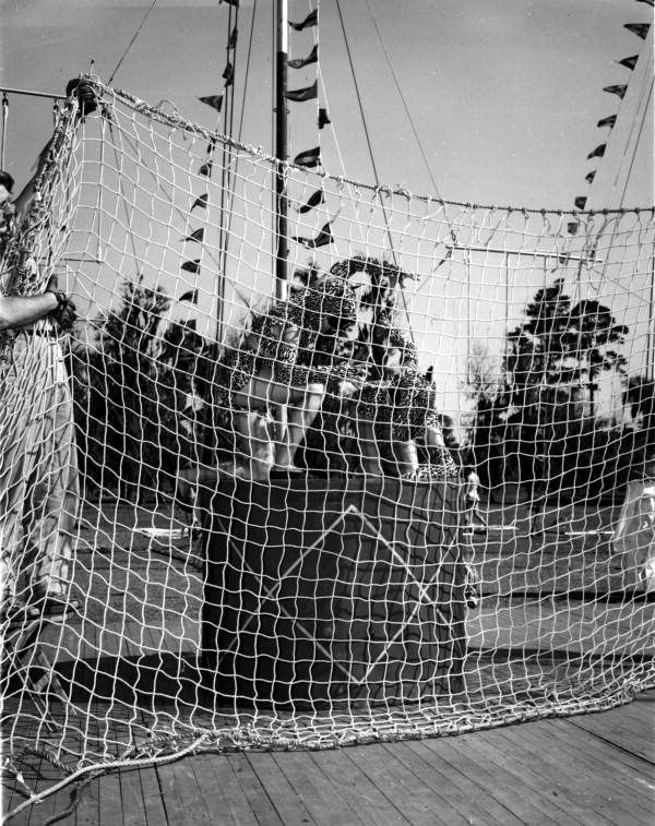 Workers pull up the net at FSU Flying Circus - Tallahassee, Florida