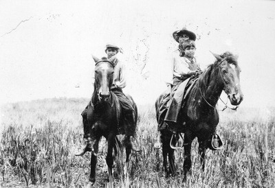 Three Seminole Indian boys on horseback