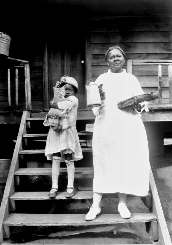 Woman and child with cat.