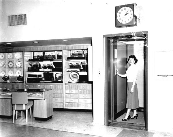 Woman in an elevator.