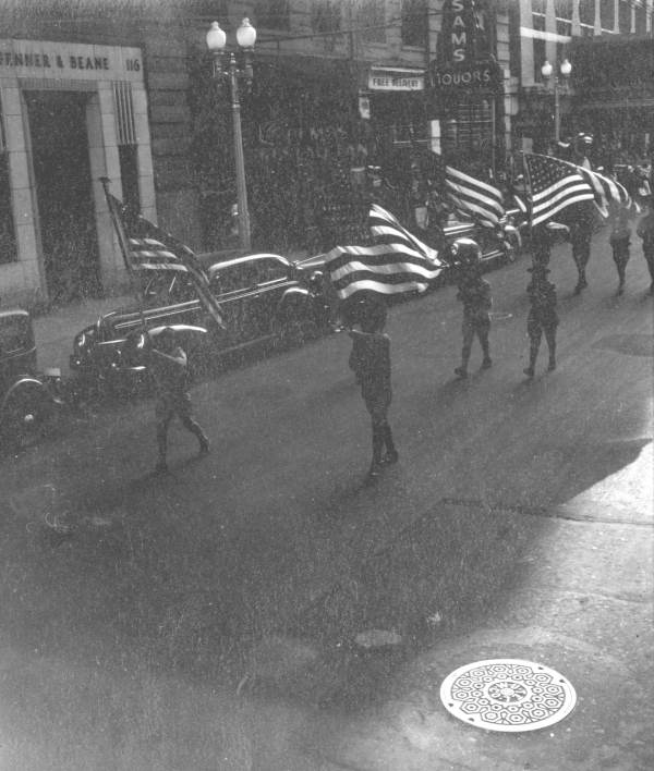 Boy Scouts in a parade.