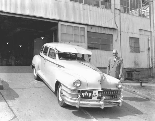 Man standing with a car.