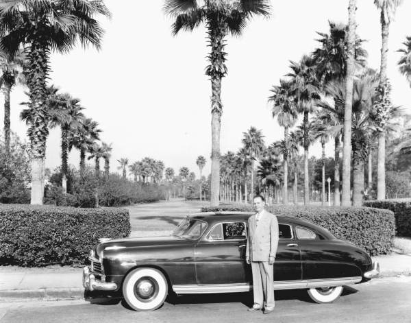 Man standing by a car.