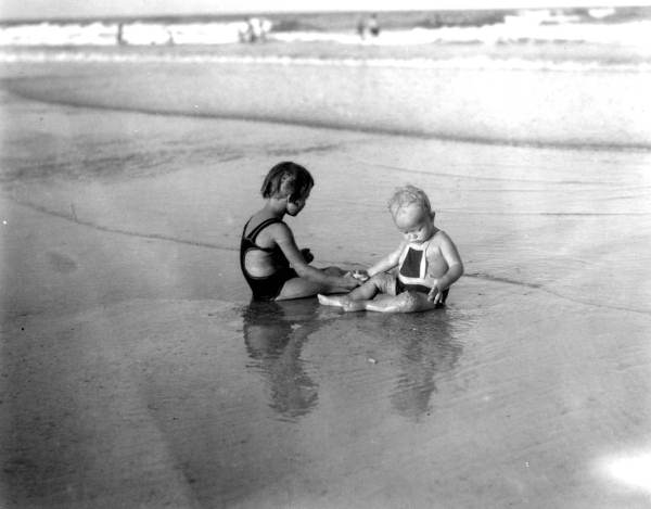 Baby and child at the beach.
