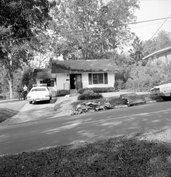 Authorities at residence at 1122 N. Bronough St. after an arson fire - Tallahassee, Florida.
