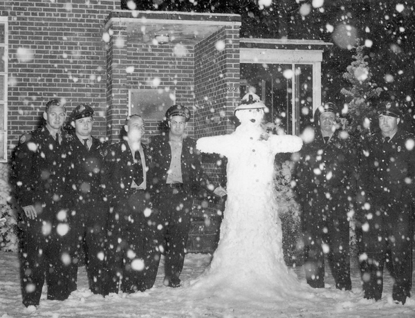 TFD firefighters with snowman in front of station #2 at 224 E. 6th Ave. in Tallahassee, Florida.