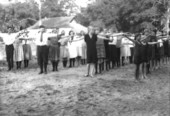 Camp members exercising their arms