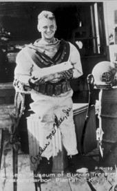 Postcard of treasure hunter Art McKee holding silver bar retrieved from "El Capitana" wreck - Plantation Key, Florida