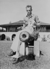 Treasure hunter Charlie Brookfield sitting on a cannon