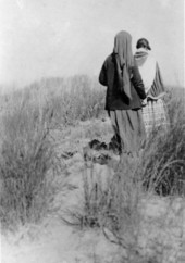 Deaconess Bedell and a Mikasuki woman walking in the Everglades