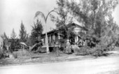 Deaconess Bedell standing outside the mission